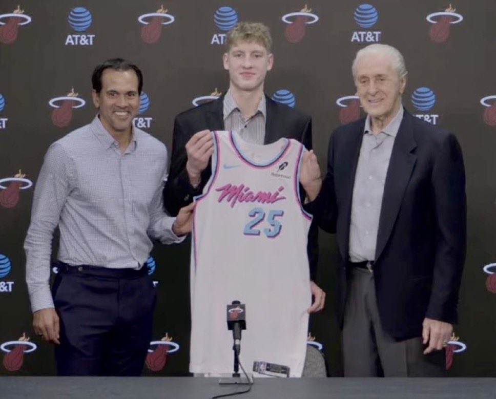 IlliniMuse's tweet image. First look at former #Illini star Kasparas Jakucionis with his Miami Heat jersey and new coach Erik Spoelstra and GM Pat Riley. KJ will wear number 25 in Miami.