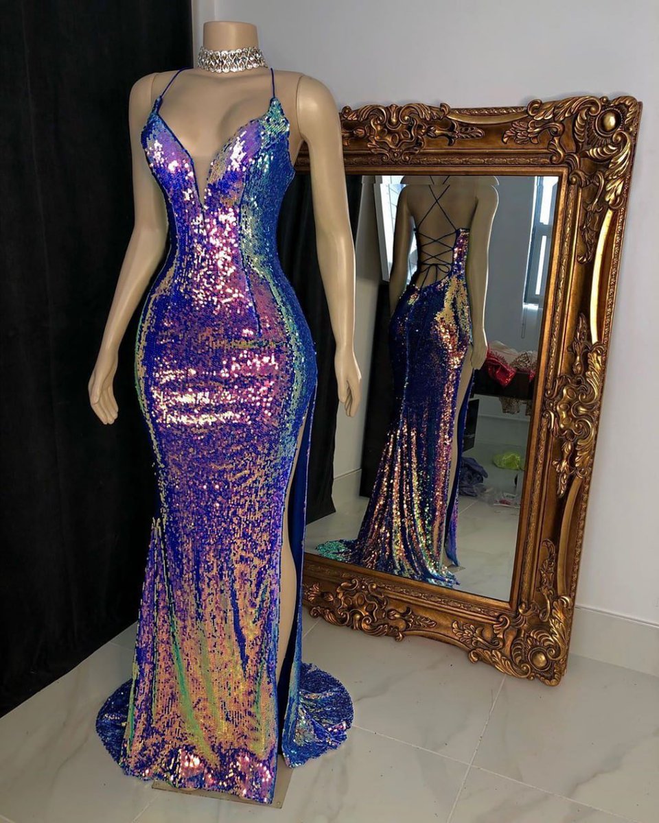 Unleash your inner goddess in this stunning, iridescent sequin gown.  A true masterpiece of fashion.