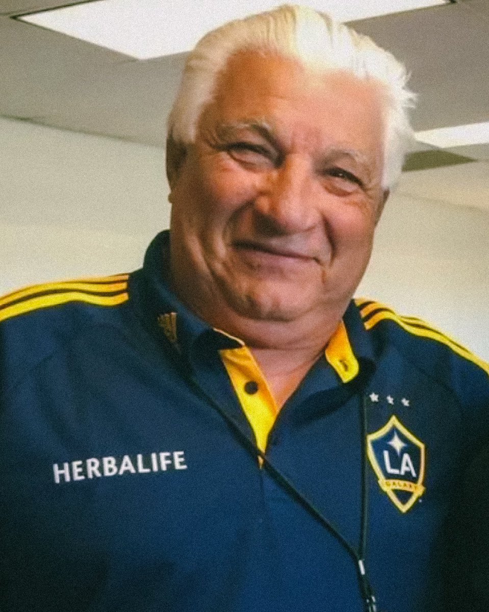 LAGalaxy's tweet photo. We are deeply saddened to hear of the passing of Rolando “Veloz” González, a cherished member of the LA Galaxy family and an iconic voice in our club’s history. For decades, Veloz’s passion and energy connected generations of fans to the game, capturing the heart of LA Galaxy matches on the airwaves. We extend our deepest sympathies to his family, friends, and all who knew and loved him