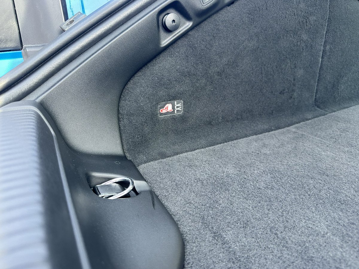 Autoline's tweet image. There’s an app that helps first responders find the “cable cut” spots on EVS in case of an accident. But to help them find it faster, #Dodge added these fireman’s hat icons in the trunk and under the hood of the Charger EV. Such a simple but effective visual aid.
