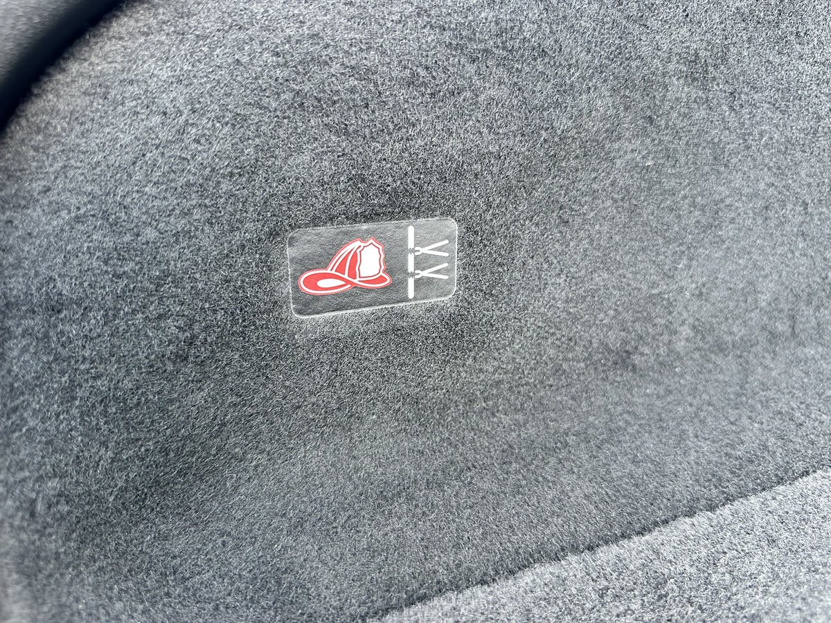 Autoline's tweet image. There’s an app that helps first responders find the “cable cut” spots on EVS in case of an accident. But to help them find it faster, #Dodge added these fireman’s hat icons in the trunk and under the hood of the Charger EV. Such a simple but effective visual aid.