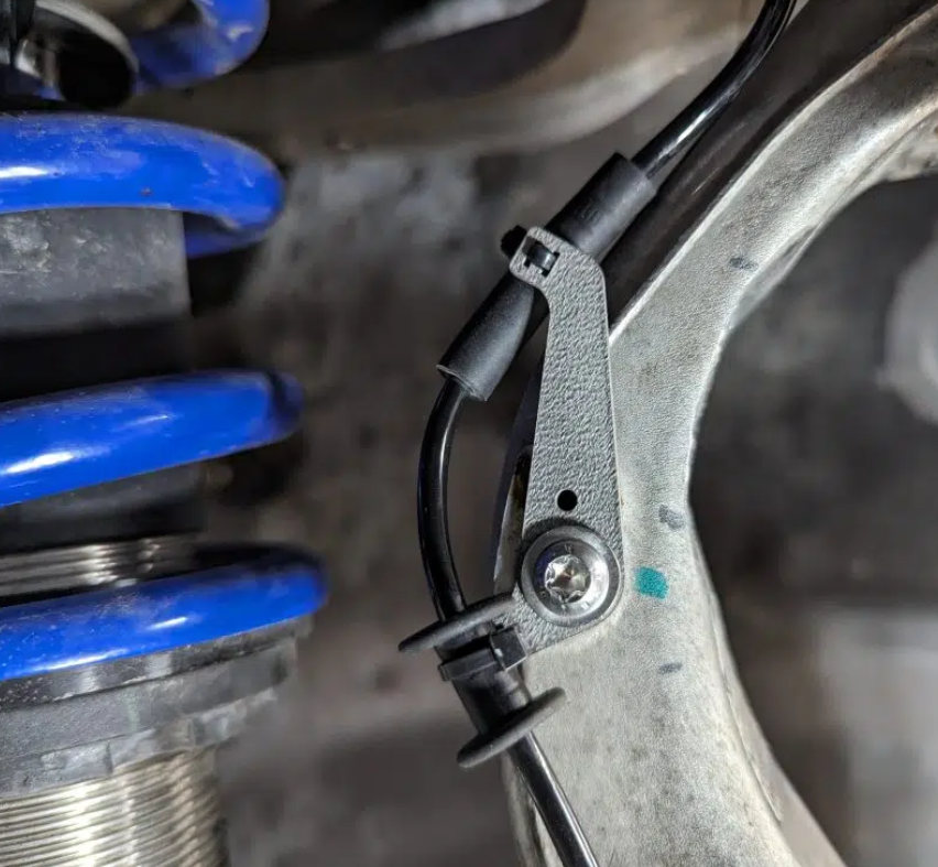 Sometimes the most effective solution is the simplest one.
Those of you running wide wheels may already be familiar with the trials and tribulations of the factory wheel speed sensor. Keeping that wiring out of harm's way is incredibly important, as a torn wire or crushed sensor