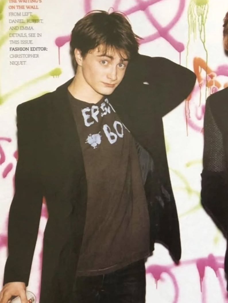 toothybj's tweet image. Daniel Radcliffe wearing a "Epstein Boy" tshirt in a photoshoot. The clues were always there 😔