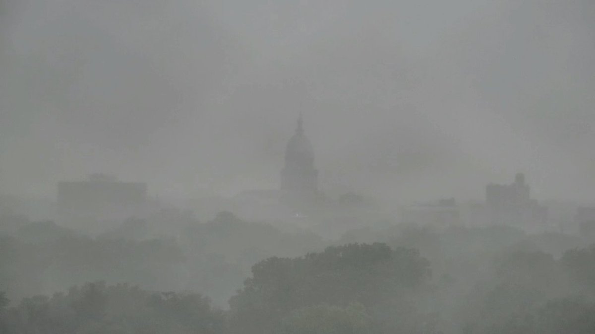 The heavy downpour over Springfield is totally obscuring the city skyline.  Springfield looks rather eerie.  Expect more scattered showers &amp; storms over parts of central Illinois through this evening with locally heavy rain for some.