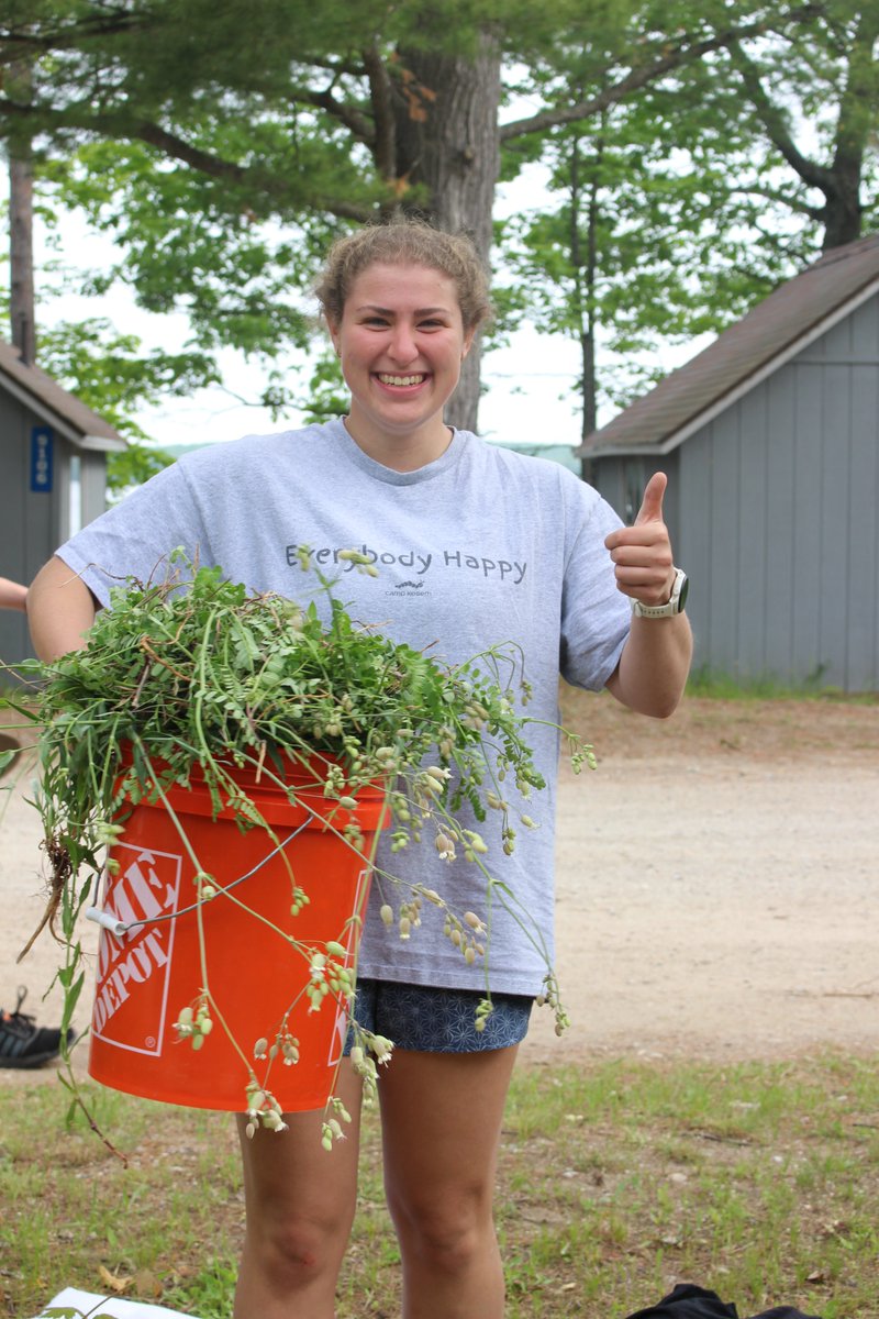 UMBS's tweet image. As a community service project, @UMBS students in the General Ecology Lab course taught by Dr. Corrine Monks, pictured in the bottom middle of the group photo, weeded the rain garden outside Gates Lecture Hall.