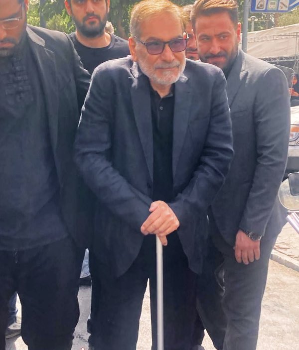 Hundreds of thousands of Iranians attend the funeral of 60 martyrs of the Zionist regime’s aggression against #Iran. 
Among the officials seen among the crowds in Tehran is Ali Shamkhani.
It was claimed that he’d lost his legs, but that turns out to be false.