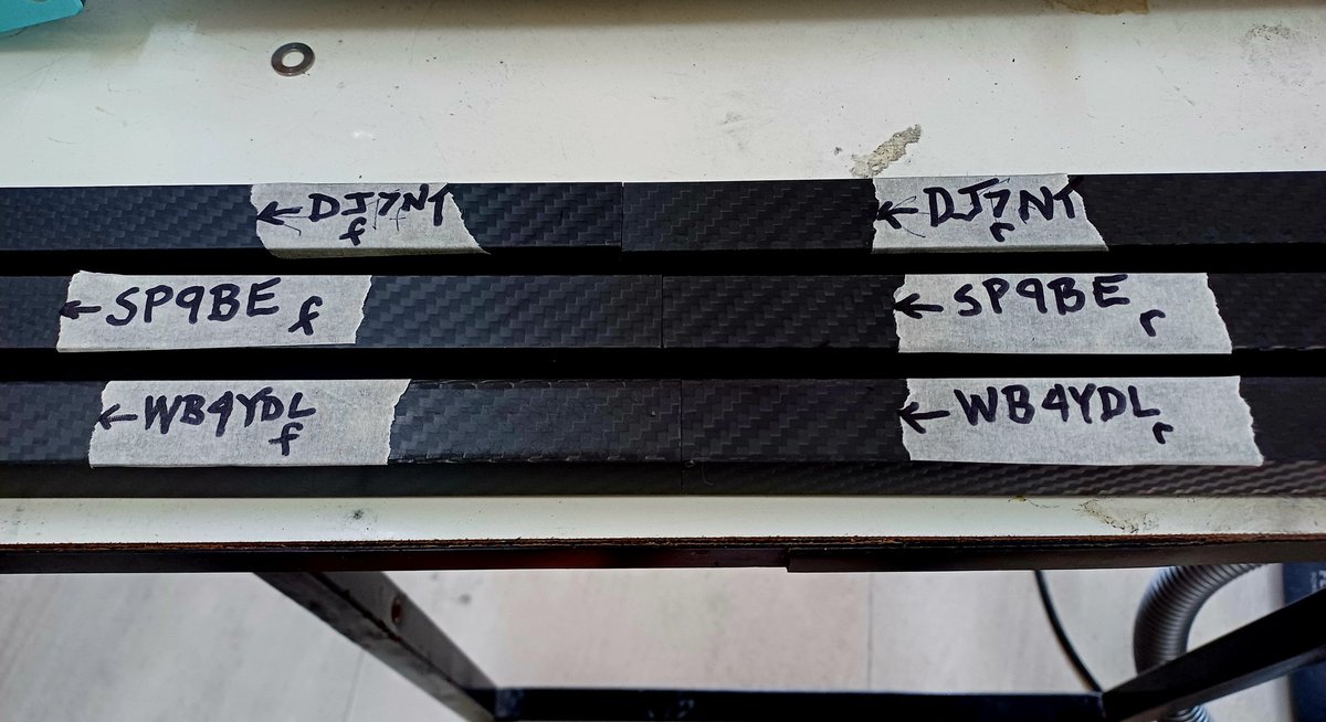 New carbon fiber booms get marked to show how the halves match, which is the top, where's the front, which is the front/rear half, and most importantly, who it belongs to!