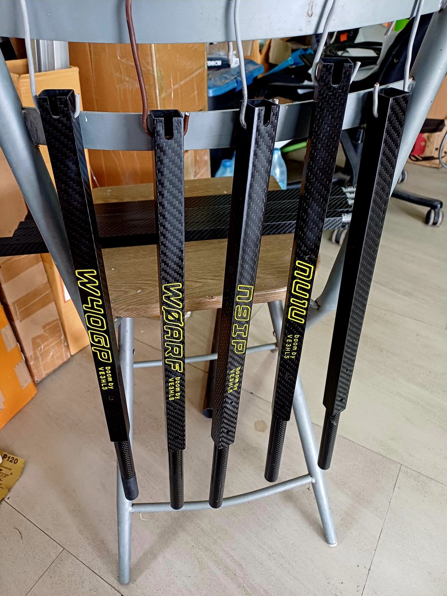 Five more carbon fiber booms in the VE3HLS Climate Controlled Drying Booth after receiving a final clear coat of lacquer