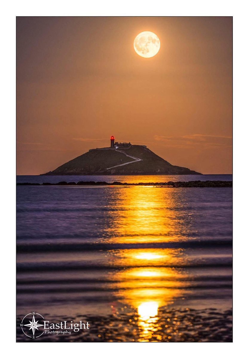 Friday night’s Strawberry Moon rising over Ballycotton Lighthouse, East Cork, Ireland.