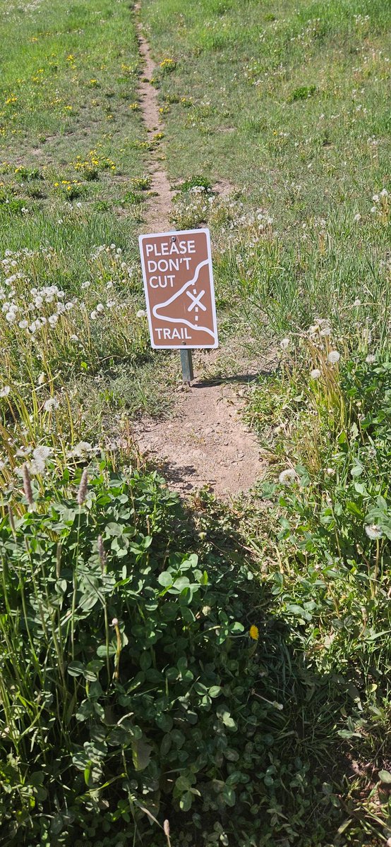 spomboy's tweet image. Another environmental genius at work. If it really makes a difference to have humans walking on grass that deer, elk and bear freely tread, maybe don't put the sign in the middle of the trail forcing people to cut a path around it. #idiots