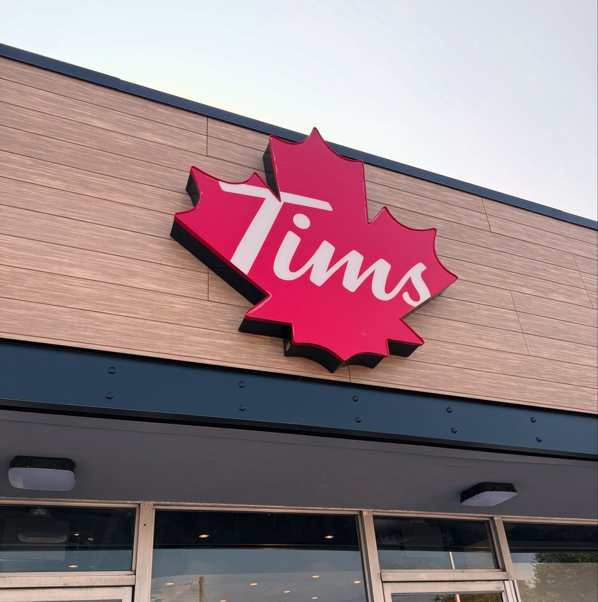 k8lovett's tweet image. I guess nothing says “Welcome back to America” like swinging by the new Tim Hortons. 😅🍁