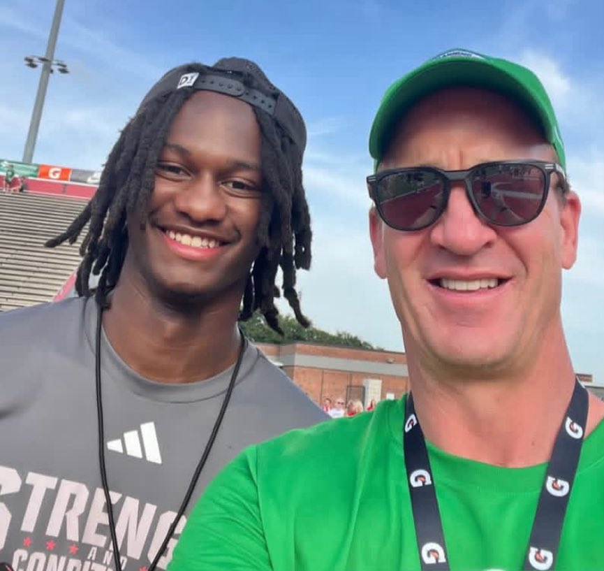 NC State QB CJ Bailey and Peyton Manning chillin during the Manning Passing Academy. Just normal things.