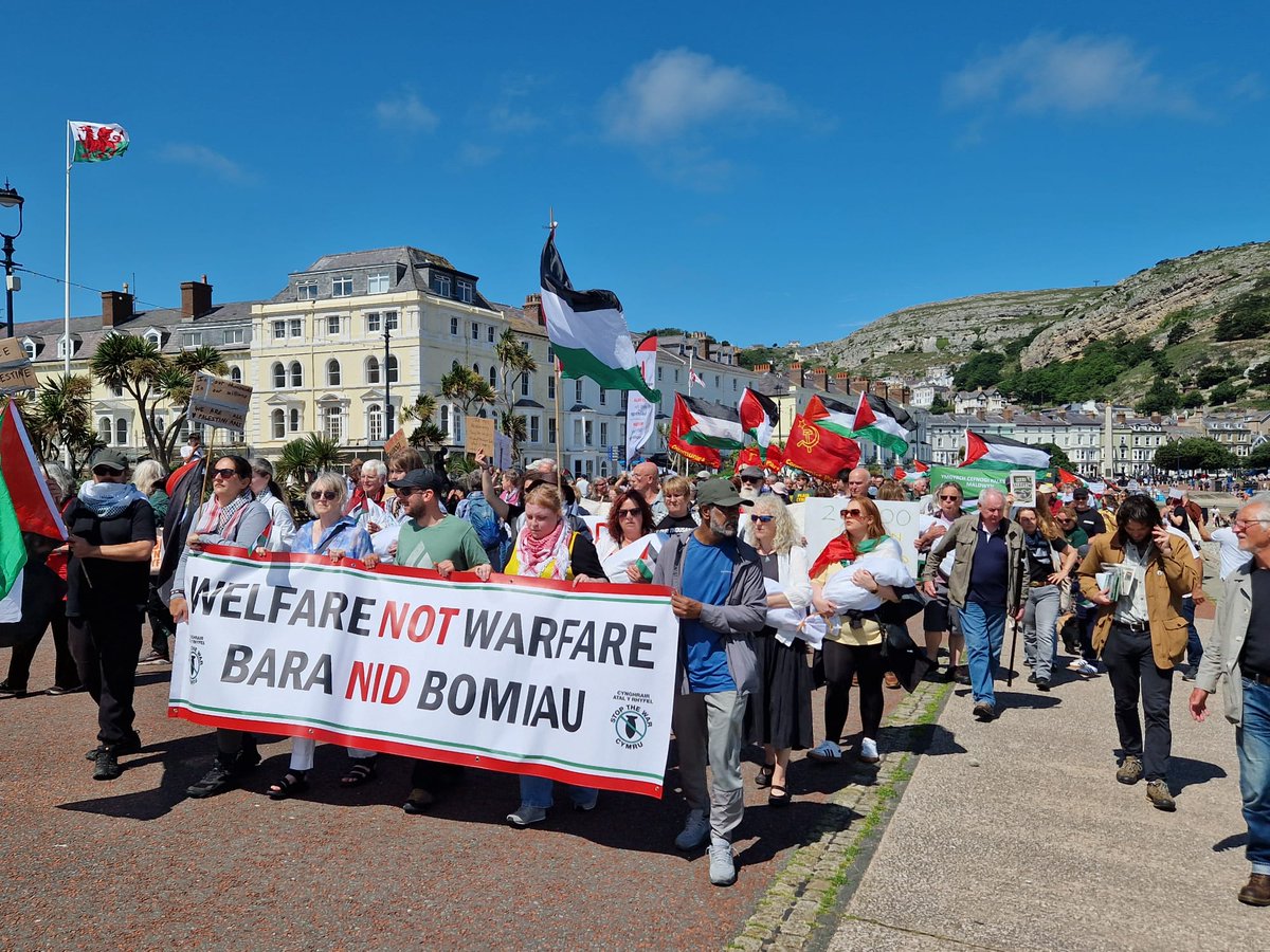 CymruSTW's tweet photo. Stop the War Cymru joined the nearly thousand strong rally at @WelshLabour conference to make clear the priorities of Wales: Welfare not Warfare, Bara did Bombay https://t.co/N9pfgOvO3X