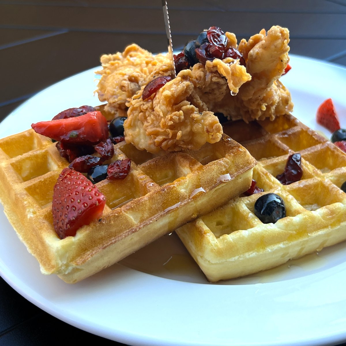 It's Sunday Metal Brunch, 10 am - 3 pm. CHICKEN AND WAFFLES: two Belgian waffles, fried chicken breast, garnished with fresh fruit and honey.