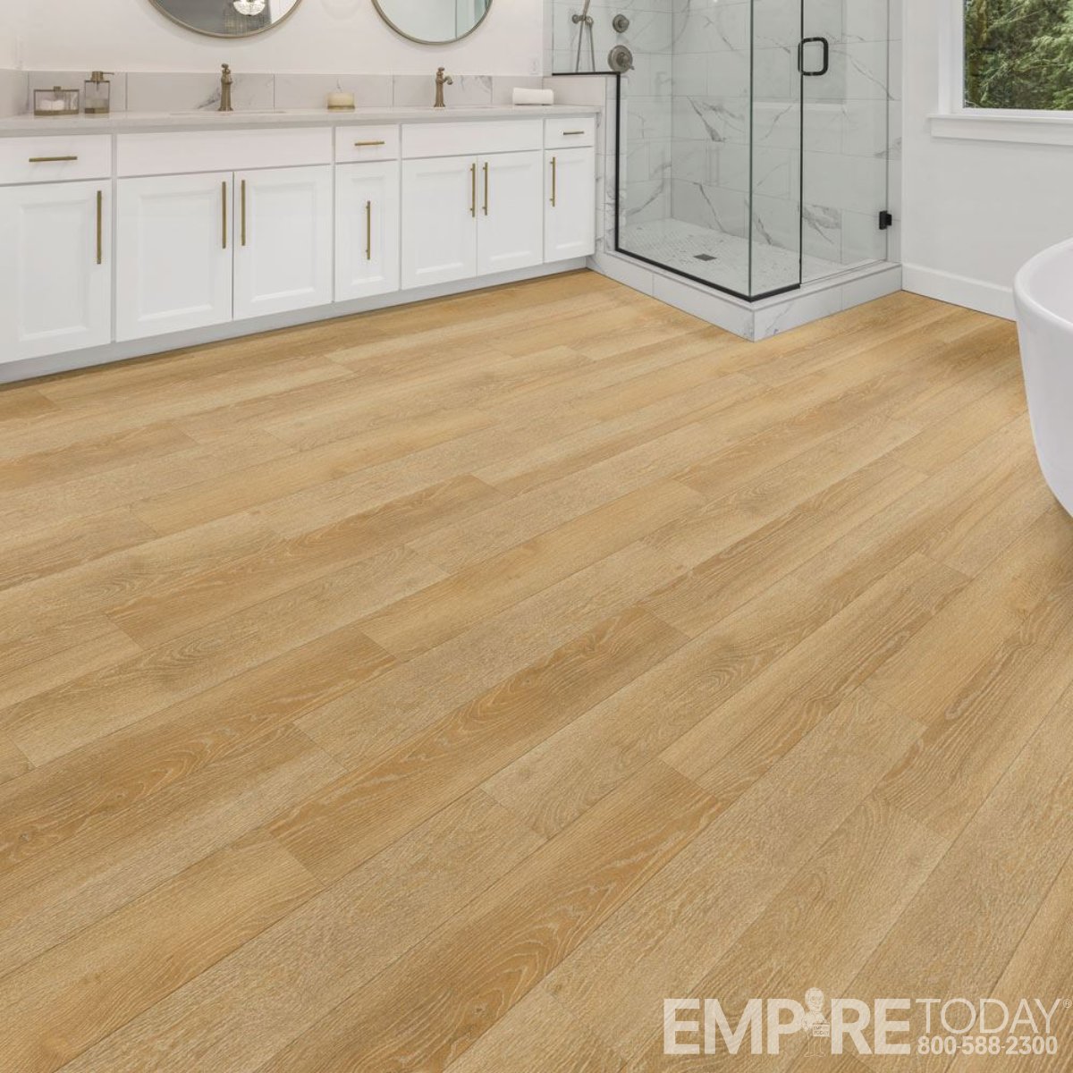 Elevate your bathroom with the beauty of wood-look vinyl planks that can handle a splash.

empire.today/4kVLLJx