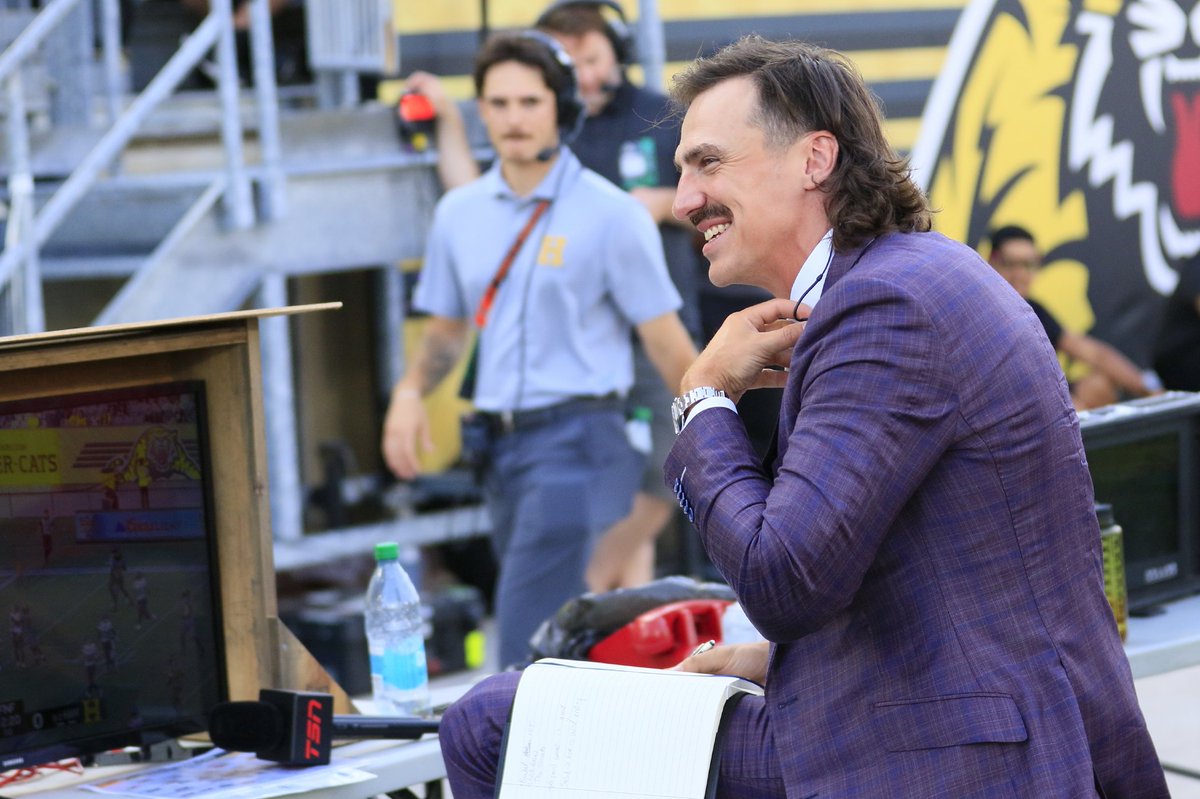 #AtWork_2 
A juxtaposition of the present (the 2020's high-end TV monitor) and the  past (this protective wood frame like a television console straight outta Gilligan's Island😅).
A metaphor for the game of 🏈
Everything and everybody works together to get the job done 🫡