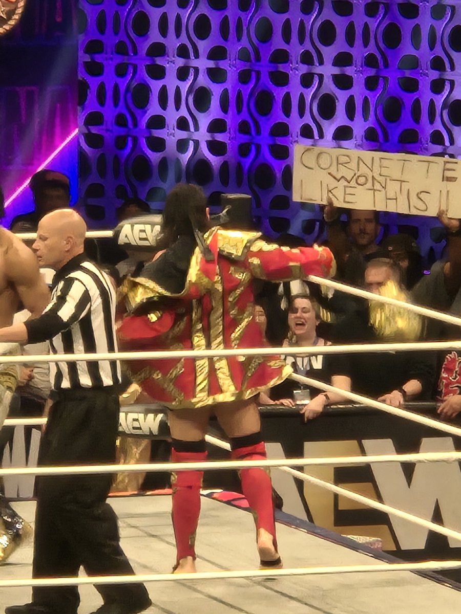 drswank's tweet photo. @TheJimCornette Opportune pic of a goofy, grinning, bad haircut with a cornette sign at dynamite on wednesday. https://t.co/ay6AUQBEG7