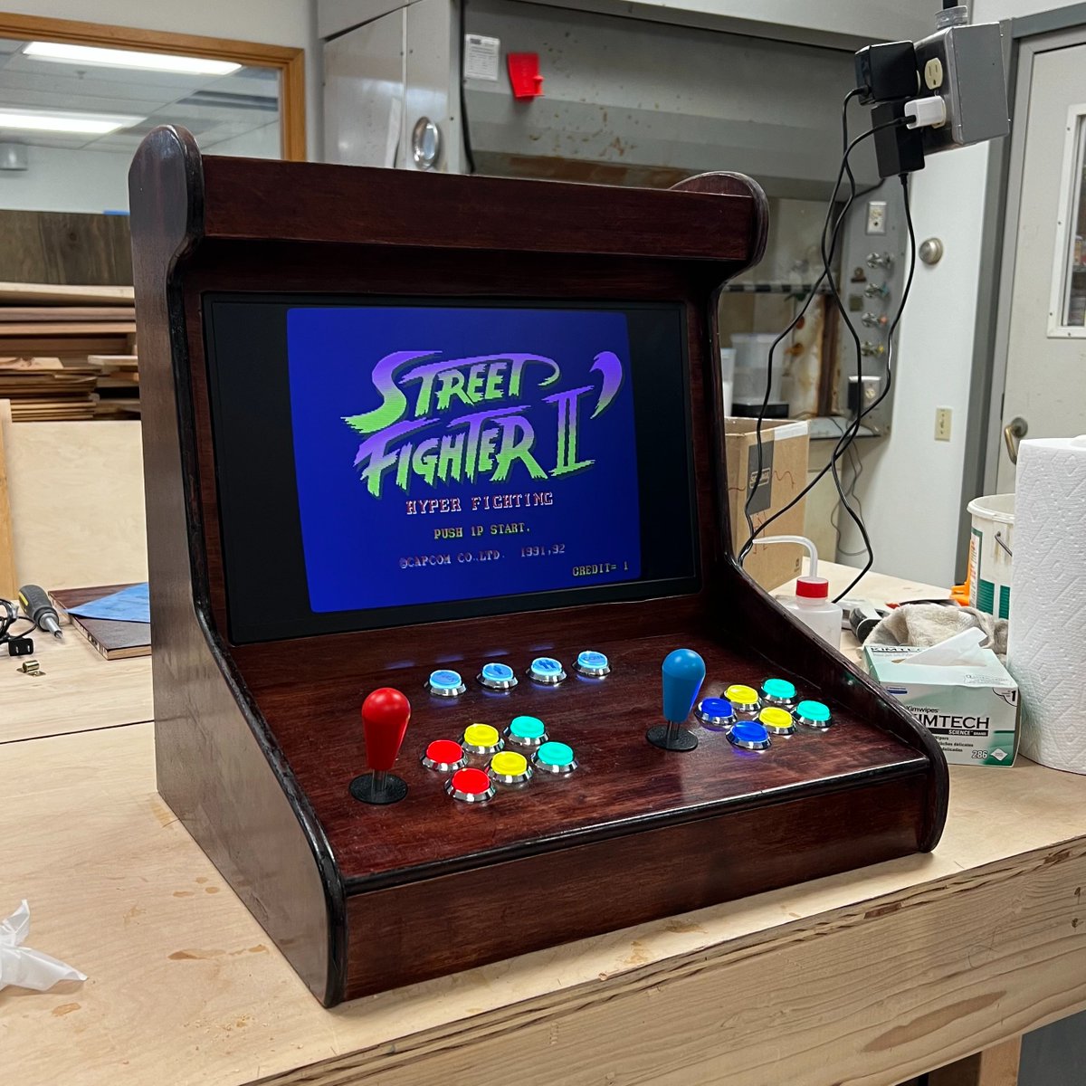 The cab that started it all. Our custom built natural wood table-top arcade. Ready and loaded with all the arcade classics 👾