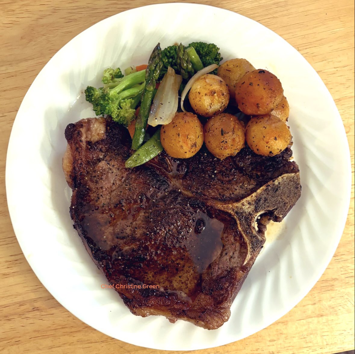 Mouthwatering pan seared T-bone steak, sautéed vegetables and roasted herbed Parisian potatoes 🍷