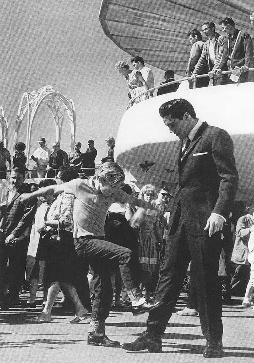 A young Kurt Russell kicking Elvis Presley in the shin in the film “It Happened at the World’s Fair” (1963).