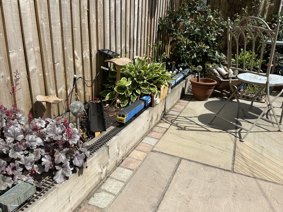 Work in progress the Cardiff Exeter service (static) 18ft long O gauge on the garden sleepers,all 2nd hand loco wagons coaches signal station that’s lit up with solar mushrooms on a night, bridge to paint middle tunnel old knife holder to go green, #gardenrailway #trainspotting