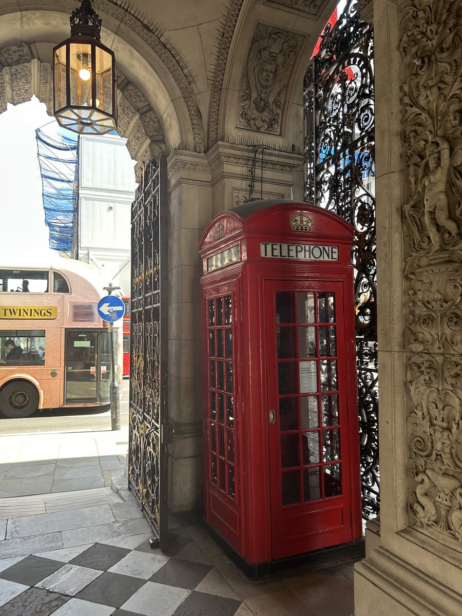 I was taking a picture of this red phone box on Piccadilly, after looking at biscuits in Fortnum &amp; Mason, as a Twinings tea double decker bus drove by. Britishness overload.