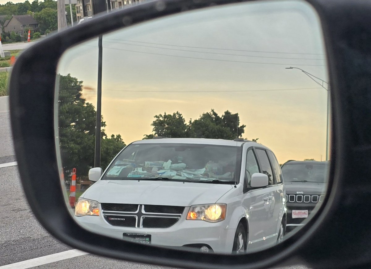 Saw this car pull up to the stoplight today.... how does one let their car be so cluttered that you can't see out of it?!?!?