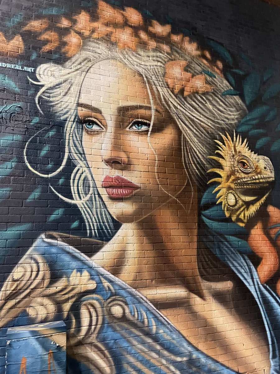 Veebumblebee1's tweet photo. Street art by VLAD in London
⚪️In the Urban Nature" by VLAD, who operates under the name DREALART. 
The mural depicts a woman with an iguana on her shoulder, blending a realistic portrait with vibrant colors and elements of nature. https://t.co/dhp1Qpzbbs