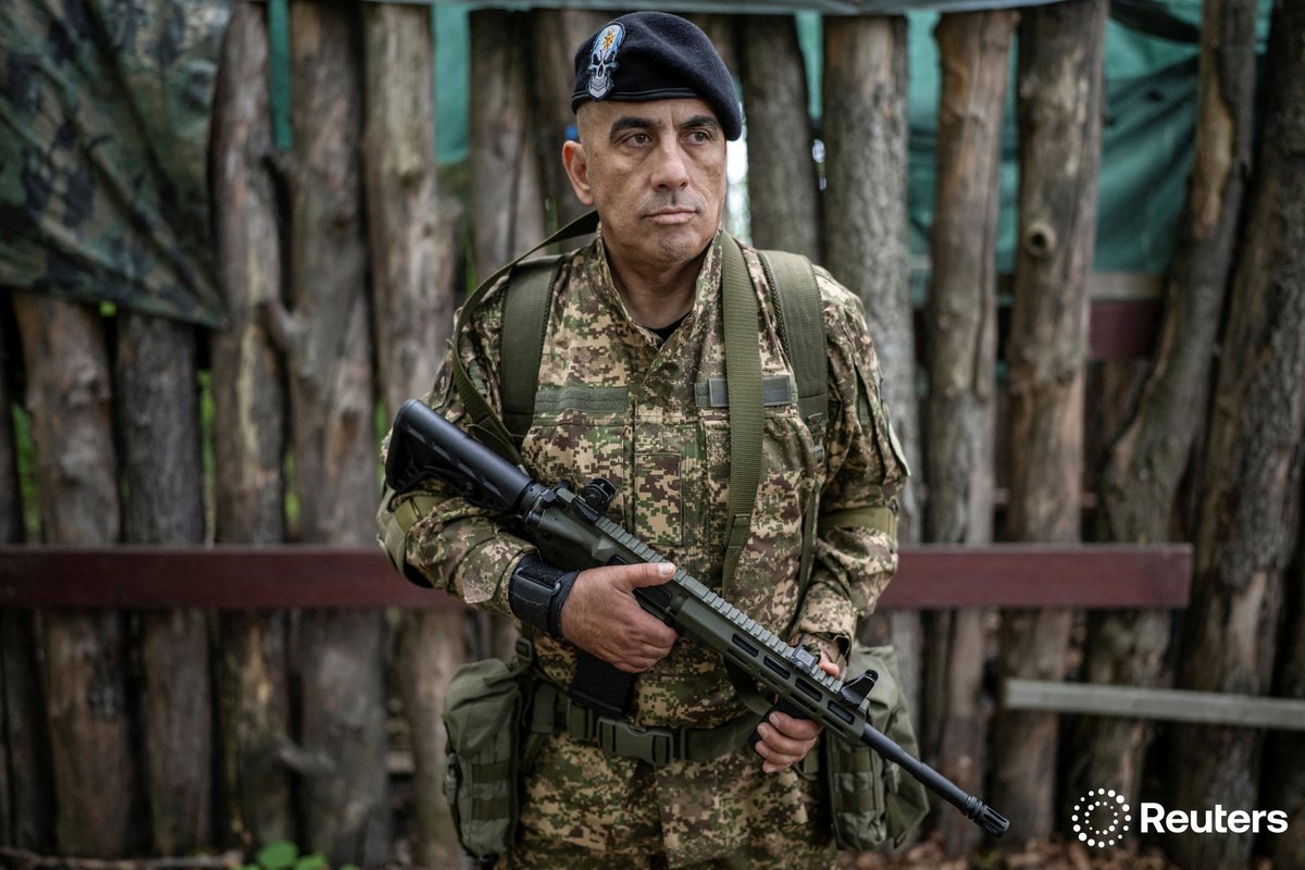 A foreign volunteer of the National Guard of Ukraine looks on during a military exercise at a training ground near the frontline in Kharkiv region, Ukraine. More photos of the week: reut.rs/4kbn62H 📷 Viacheslav Ratynskyi