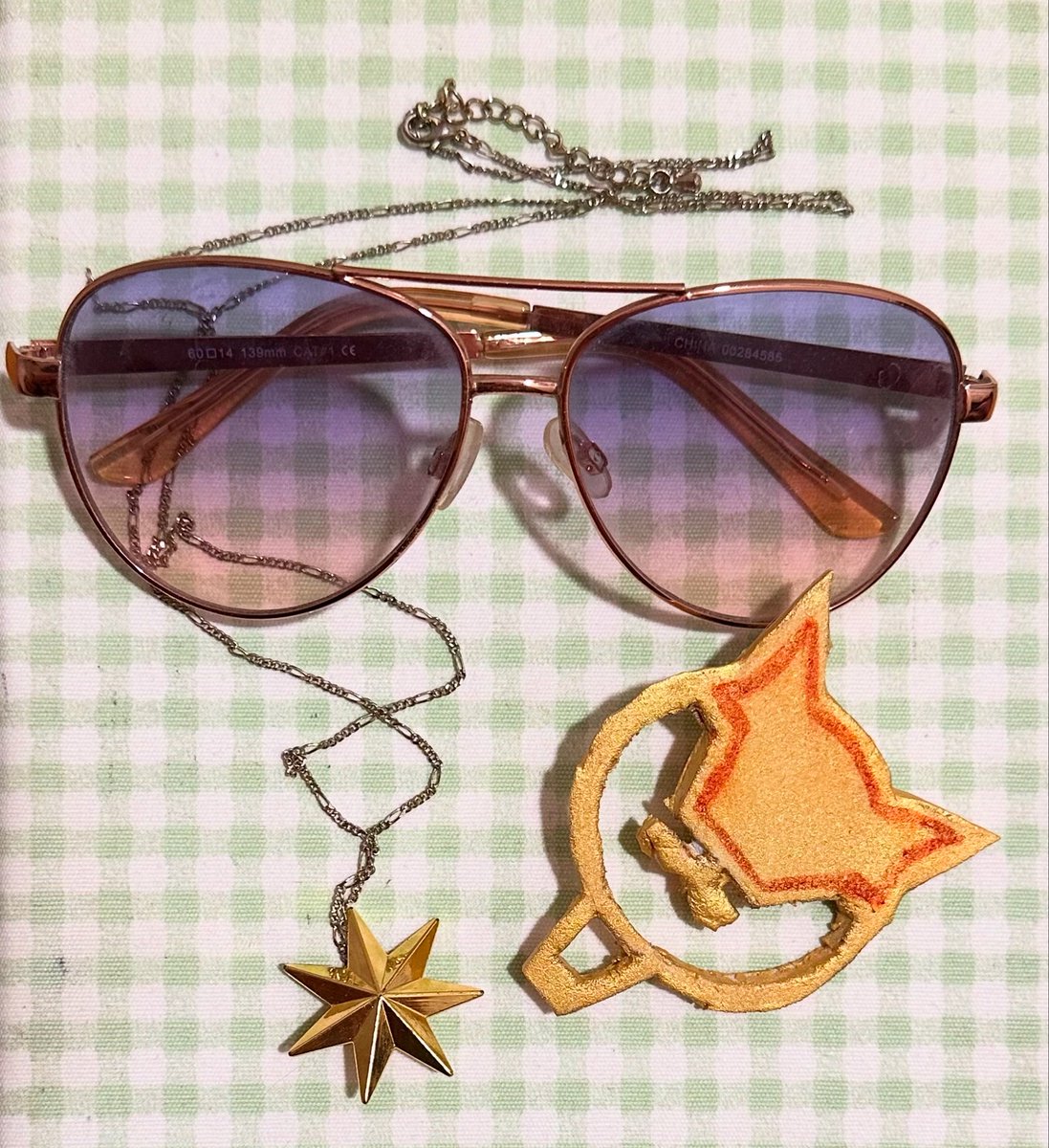 MichelleAMarie's tweet photo. So ready to represent my girl this weekend! 💛🥤⭐️ 

I DIY'd the necklace, already had the sunglasses, and thanks to @Taytori's suggestion to use Eva Foam, I was able to make Anis' hairclip just fine! 😊
#NIKKE #AnimeExpo2025 https://t.co/9ZSDD6eHwW