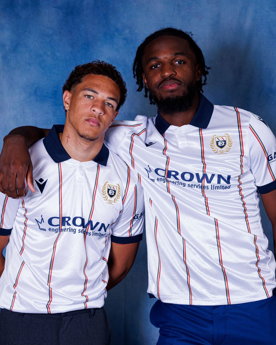 footballshirt's tweet image. Dundee FC have revealed their new Away kit for the 2025/26 season, produced by Macron. 

The shirt is white with thin vertical stripes in navy and red, paired with a navy collar and sleeve cuffs. 

#DundeeFC #macronsports