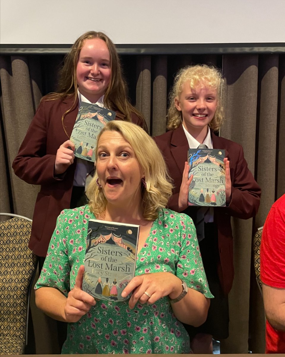 Four students represented QKS at the Cumbria School Book Awards Day in Penrith on Thursday. Here are Jess &amp; Poppy with author Lucy Strange who delivered a great author talk. They also won the poster competition with an amazing 3-D, light-up version! #QKSProudToBelong