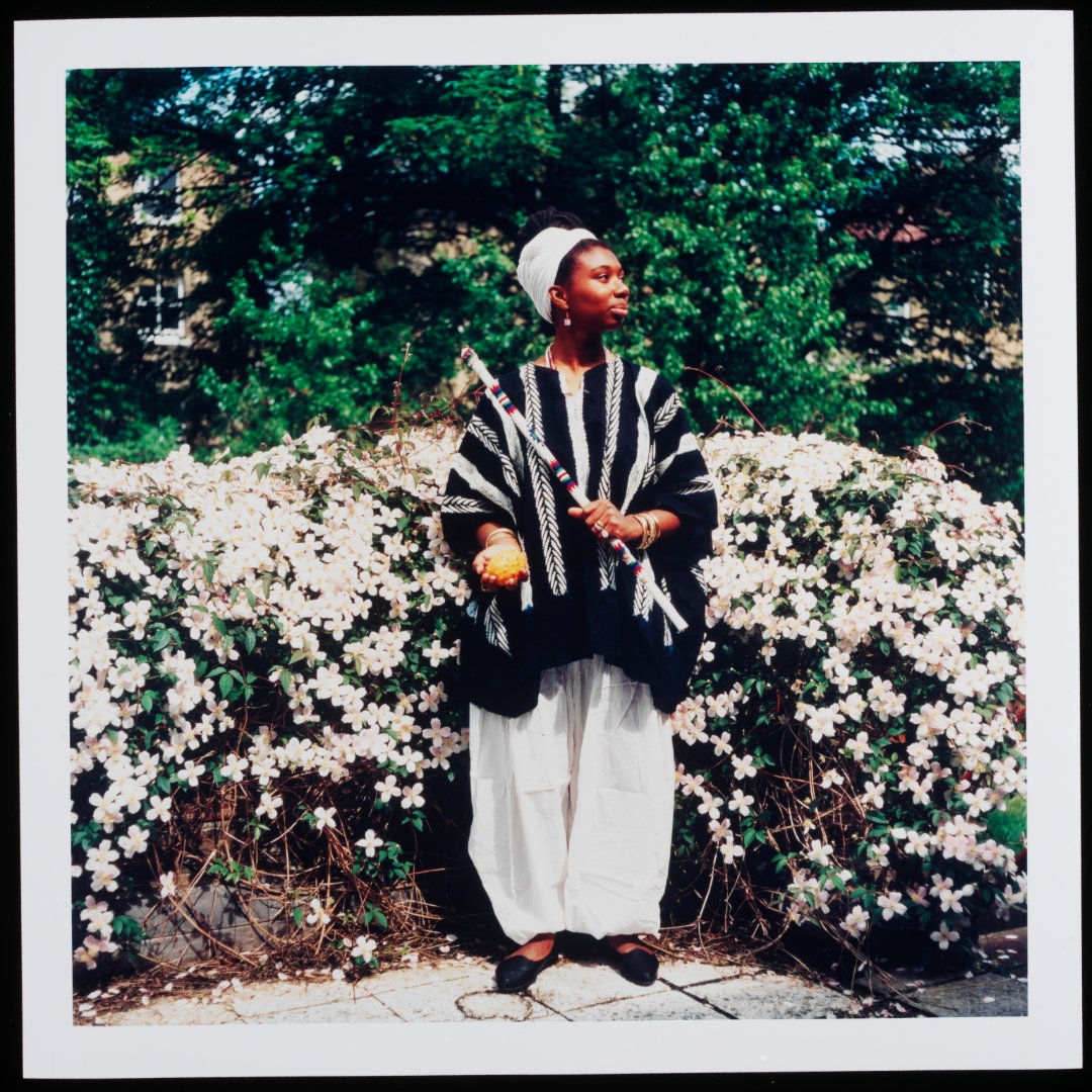 V_and_A's tweet image. Ingrid Pollard, pioneering Black British photographer and ABP founder, challenges cultural stereotypes in her Self-Evident series. Portraits of black men and women in the English countryside, each holding objects linked to the Afro-Caribbean diaspora.