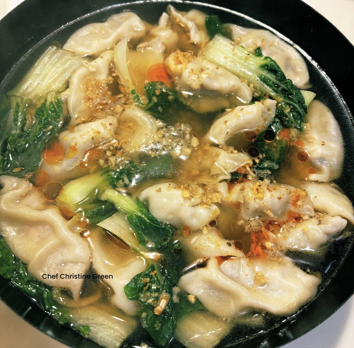Absolutely delicious pot of minced pork, shrimp and wood ear fungus filled dumplings with Bok Choy soup 🥟