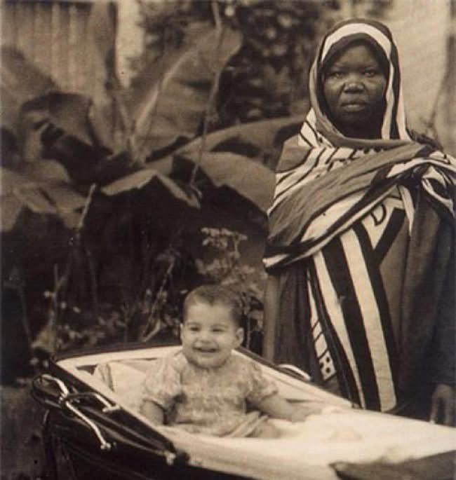 IndiaTales7's tweet photo. 15. An exhausted nanny poses with her young charge, named Farrokh Bulsara. A quarter of a century later, he would adopt the pseudonym of Freddie Mercury. Zanzibar, 1947. https://t.co/taEYcHmnL8