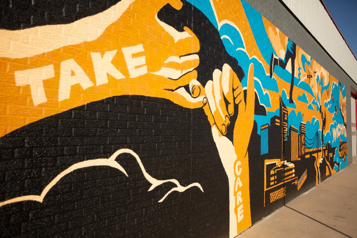 Wichita's art scene is impressive and continues to grow. Try walking around downtown and not be mesmerized by sculptures and murals.
Mural Monday: Dear Wichita, Take Care and Dream Big
Artist: Lindsey Kernodle and Friends
📍 100-148 N Pennsylvania Ave, Wichita, KS 67214
📷 Trevor