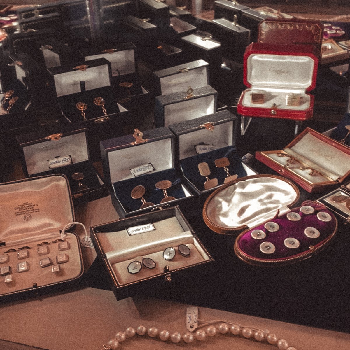 Why buy new cufflinks when you can wear tiny antiques on your wrists?