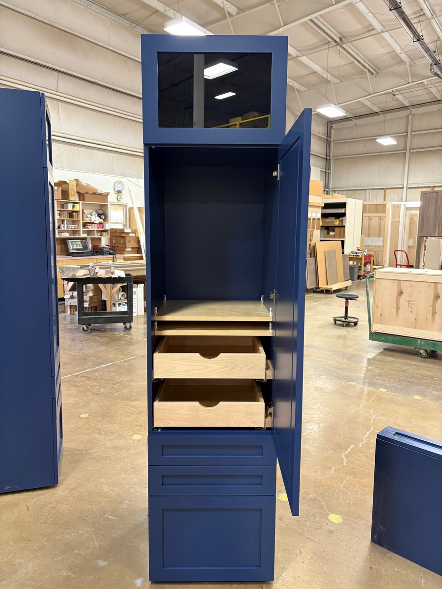 #ThruTheShopTuesday

Striking cabinet finished in Benjamin Moore Hudson Bay with pull outs and glass.

Visit our website for more inspiration! kountrykraft.com

#KountryKraft #customcabinets #customcabinetry #KitchenDesign #Kitchen #CabinetOrganization