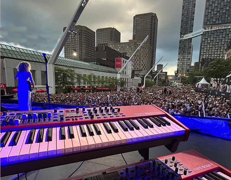 #GraceBowers performed under grey skies in Montreal yesterday during a Jazz Festival set she was very happy with.  It did rain during her band’s performance, but everyone remained unfazed.  Umbrellas popped up in the crowd, who were really into Grace’s funky music.