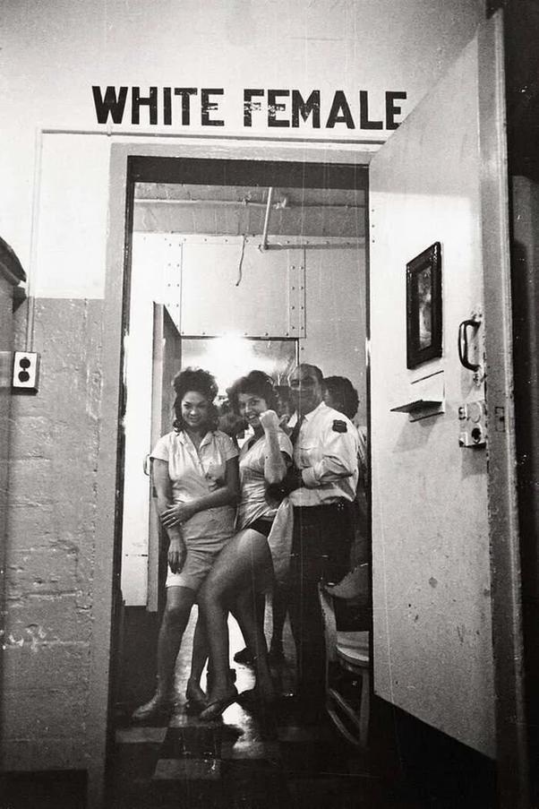 A warden at the Women's City Prison and his charges, New Orleans, 1963.