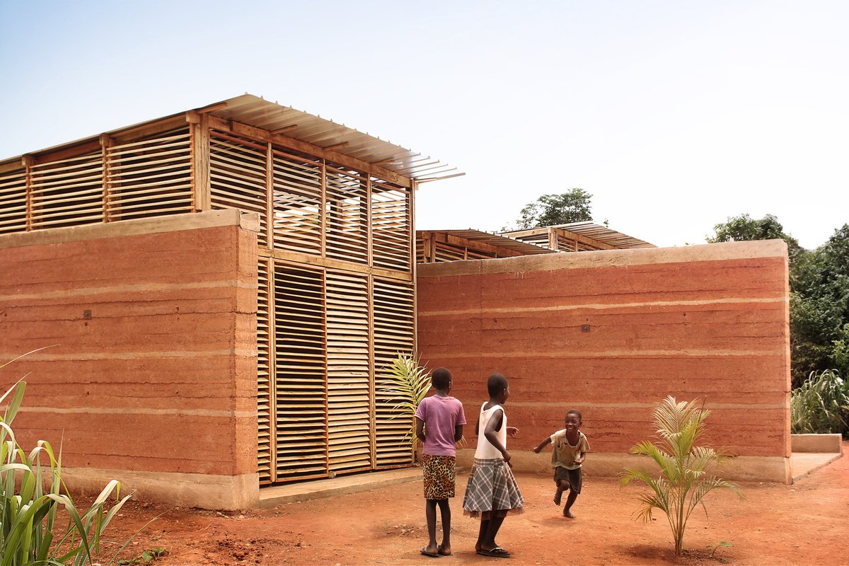 w_emerg's tweet image. Can €12,000, no electricity, and 60 days build a school? In #Ghana, InsideOut School by Andrea Tabocchini &amp;amp; Francesca Vittorini proves it’s possible, merging earth, wood, and global teamwork into award-winning, resilient architecture.
#LowCost #Architecture #BuiltByHand #Earth