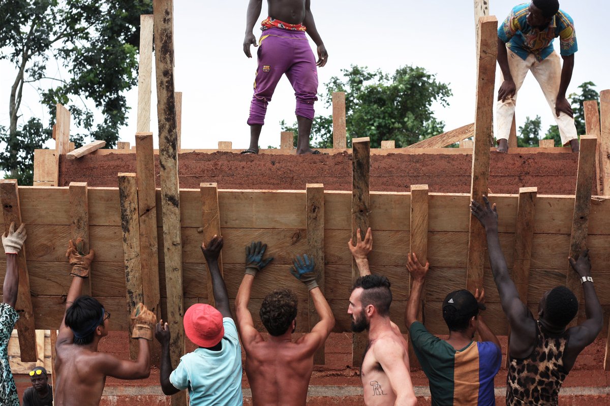 w_emerg's tweet image. Can €12,000, no electricity, and 60 days build a school? In #Ghana, InsideOut School by Andrea Tabocchini &amp;amp; Francesca Vittorini proves it’s possible, merging earth, wood, and global teamwork into award-winning, resilient architecture.
#LowCost #Architecture #BuiltByHand #Earth