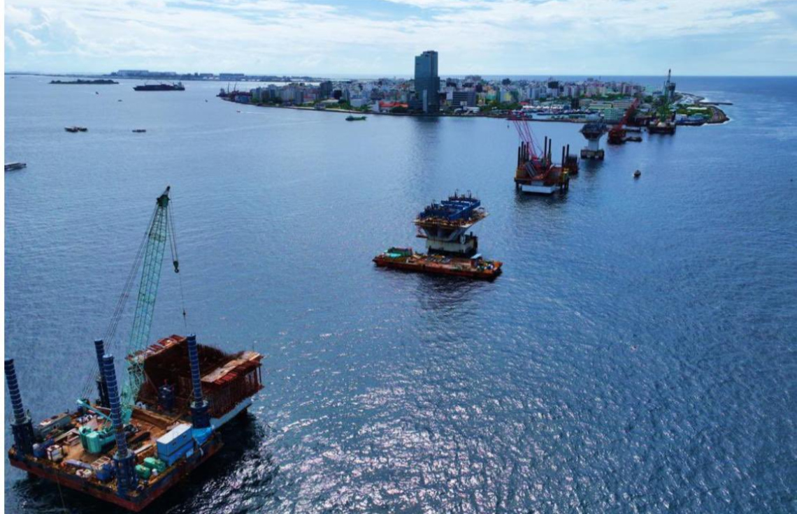 FactCheckMV_'s tweet photo. Major milestone achieved! 
The most challenging phase of the Thila-male Bridge is COMPLETE!

✅ All 263 piles installed across 68 locations 
✅ 60.84% of the entire project finished
✅ 6.7km bridge connecting Male, Vilimale, Gulhifalhu & Thilafushi
Thanks to our partnership with India 🇮🇳🇲🇻, this game-changing infrastructure will transform connectivity for all Maldivians!
#ThilamaleBridge #MaldivesIndia #Partnership