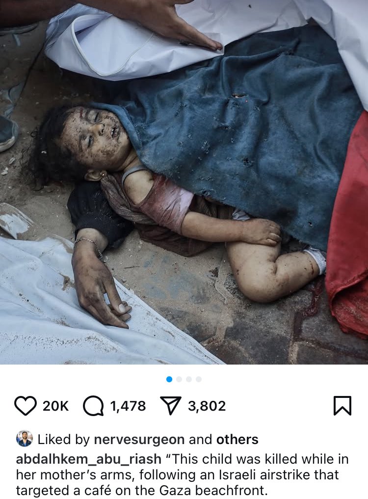 Just one of the 100 victims, a child killed in her mother’s arms. Her mother dressed her, put her frilly socks on, fastened her tiny trainers, styled her hair and then was killed alongside her at a cafe.