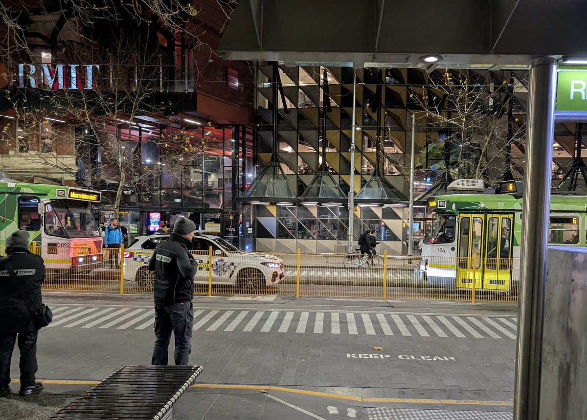 AshBinAus's tweet image. Hard to look at social media or mainstream media in Melbourne today.
Anyway, here's a highway patrol car stuck between two trams. Wtf was he patrolling anyway? No highways there buddy, that's not even a road.