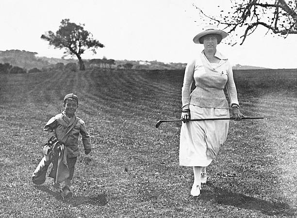 A British woman is enjoying her favorite pastime playing golf across the oppressed colonies of North Africa during the 1940s, shadowed by a young Algerian peasant boy, barely five years old, forcibly conscripted to carry her burdens. The photo was taken by Hulton-Deutsch.