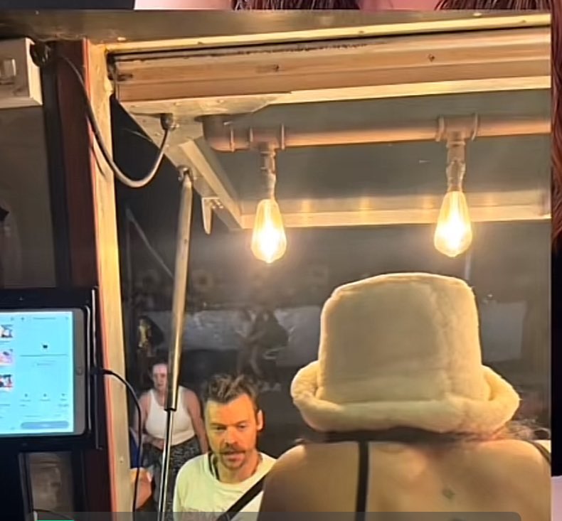 Other POV of Harry at a food stall at Glastonbury 

- June 28, 2025