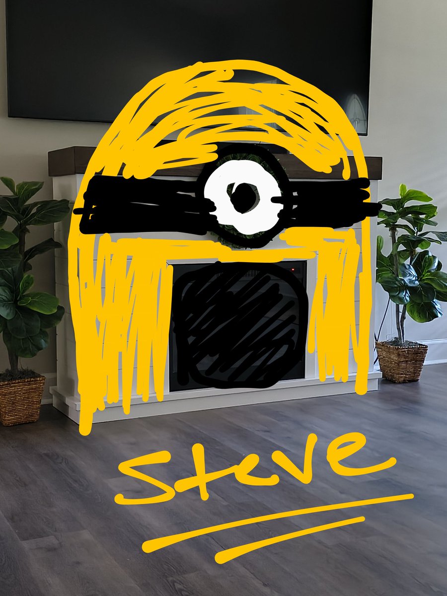 As we were sitting in the living room I told my wife "I think our fireplace looks like a minion" and then she said "I don't see it".

Which then led me to draw out what I saw, and then I said "see it now?" Haha

...and I named it Steve