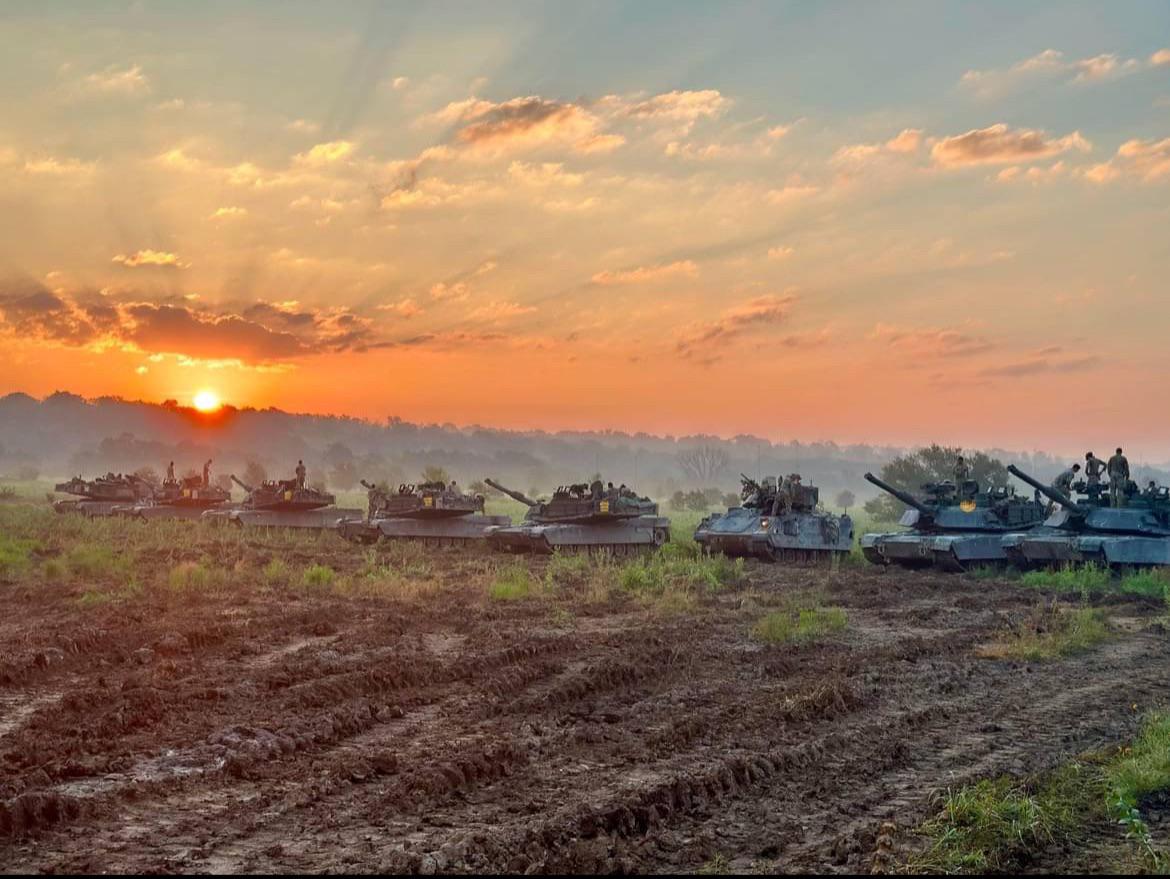Nothing to see, just a couple of M1 Abrams enjoying the sunset.