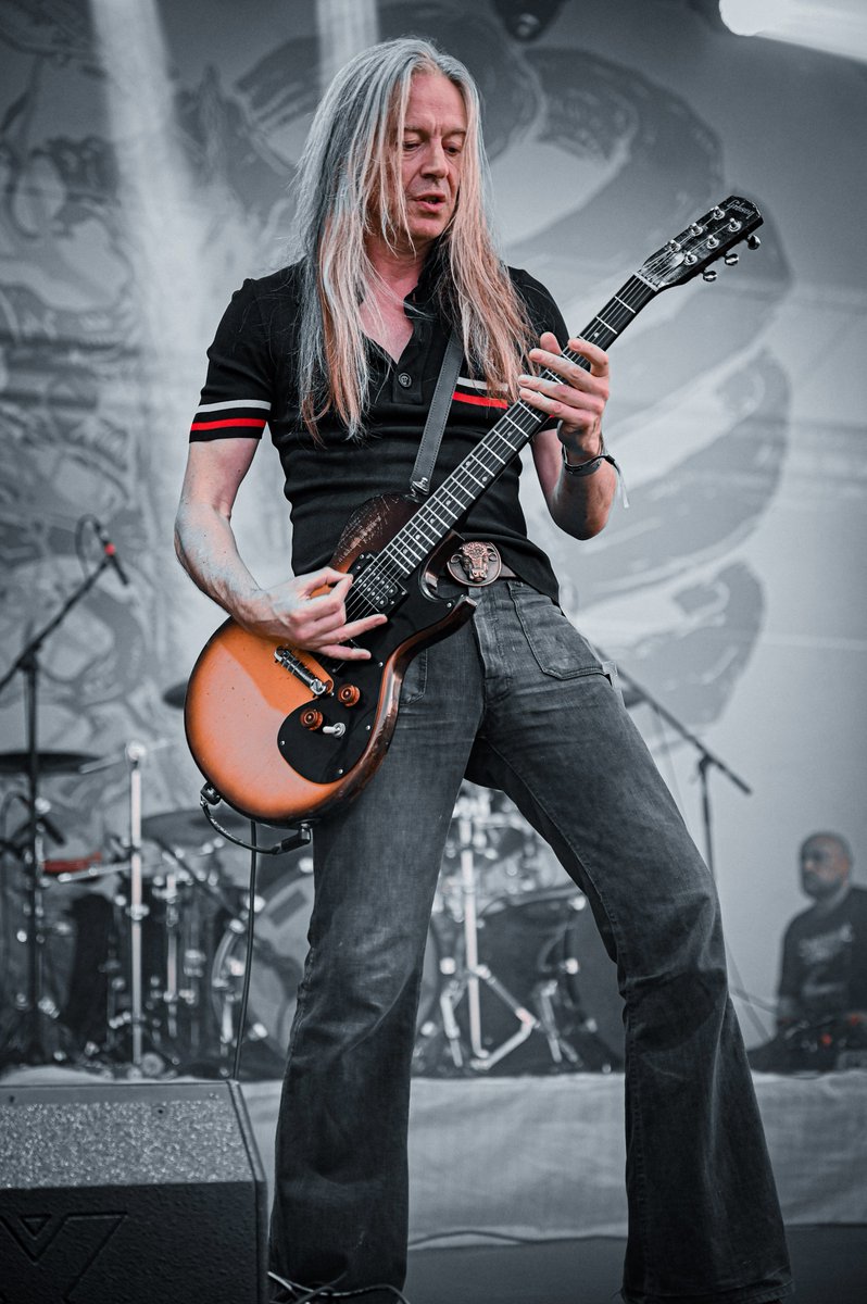 vernhardur's tweet photo. Carcass Unleashes Carnage at Basinfirefest!

Recently witnessed Carcass tear up Basinfirefest in Czech Republic—non-stop riffs, seamless song blends, old-school grind meeting fresh Surgical Steel vibes. The crowd went wild as "Heartwork" flowed straight into "Exhume to Consume" without a breath. Bill Steer's guitar wizardry and Jeff Walker's growls were on fire, proving why they're death metal legends. I captured some shots of the chaos—pure energy from start to finish.